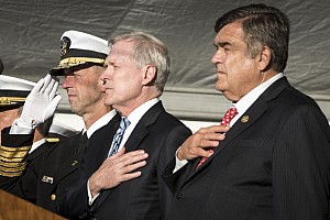 Chief of Naval Operations (CNO) Adm. John Richardson, Secretary of the Navy (SECNAV) Ray Mabus and U.S. Rep. Dutch Ruppersberger of Maryland render honors for the national anthem during the commissioning ceremony for the USS Zumwalt (DDG 1000).