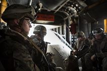 U.S. Marines with the 24th Marine Expeditionary Unit (24th MEU), ride in a CH-53E Super Stallion helicopter during a disaster relief mission in Port-au-Prince, Haiti, Oct. 10, 2016. The 24th MEU is part of a larger U.S. response to the government of Haiti request for humanitarian assistance. The U.S. effort is coordinated by the Department of State and the U.S. Agency for International Development.  (U.S. Marine Corps photo by Lance Cpl. Melanye E. Martinez)