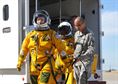 Secretary of the Air Force Deborah Lee James walks to a U-2S as Senior Airman Aaron Saenz, a 9th Physiological Support Squadron launch and recovery technician, carries the high-altitude pressure suit auxiliary equipment at Beale Air Force Base, Calif., Aug. 11, 2015. The specialized pressure suit allows U-2S pilots to safely fly at altitudes reaching 70,000 feet. James visited Beale AFB to receive a first-hand perspective of high-altitude intelligence, surveillance and reconnaissance from collection to dissemination. (U.S. Air Force photo/Senior Airman Dana J. Cable) 