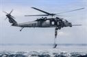 An HH-60G Pave Hawk from the 33rd Rescue Squadron at Kadena Air Base, Japan, performs a rope-ladder recovery with Airmen from the 320th Special Tactics Squadron during an amphibious operations exercise Sept. 22, 2015, off the west coast of Okinawa, Japan. Special tactics team Airmen are organized, trained, and equipped to conduct special operations core tasks during high-risk combat operations. (U.S. Air Force photo/Senior Airman John Linzmeier)