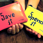 Hands holding wallets that read 'Save it' and 'Spend it'