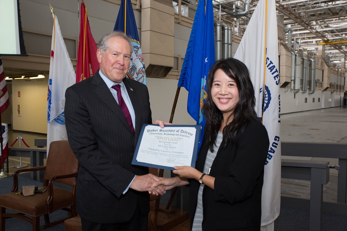 SSC Pacific’s Emily Nguyen receives a Spotlight Recognition Award by Under Secretary of Defense for Acquisition, Technology and Logistics Frank Kendall during the secretary’s recent visit to the command. Photo by Rick Naystatt/SPAWAR