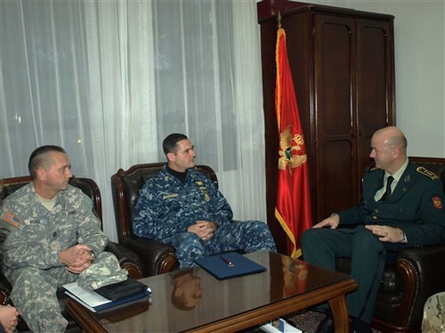 Chief Petty Officer Roy Maddocks, U.S. European Command's Senior Enlisted Leader, and Command Sergeant Major Terrence Harris, Senior Enlisted Leader of the Maine National Guard, discuss Non-Commissioned Officer corps development with Colonel Zoran Lazarevic, Chief of Staff of the Montenegrin General Staff. 