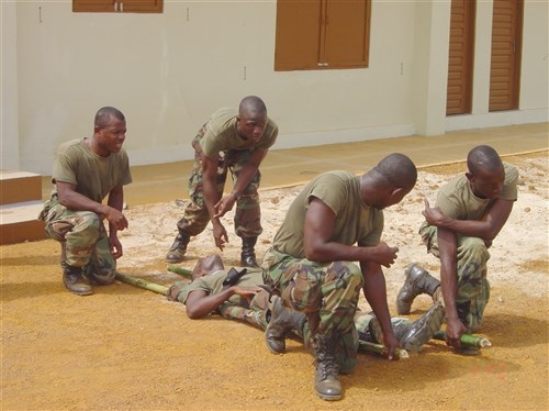 MONROVIA, Liberia &mdash; Armed Forces of Liberia medical technician students practice patient movement with an improvised litter of bamboo poles and battle dress uniform blouses here Jan. 8. The ongoing medical training is an integral part of Liberia’s military restructuring under the Security Sector Reform program being directed by U.S. European Command’s Office of Defense Cooperation, a component of the European Command Logistics and Security Assistance International Division.
(Department of Defense photo by Army Maj. Andrew Olson)