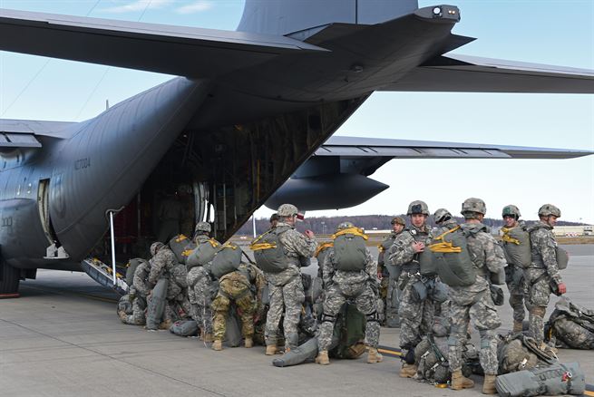 Paratroopers with the 4th Infantry Brigade Combat Team (Airborne), 25th Infantry Division, U.S. Army Alaska, prepare to board a Royal New Zealand Air Force C-130 Hercules during Red Flag Alaska 17-1 at Joint Base Elmendorf-Richardson, Alaska, Oct. 12, 2016. Red Flag-Alaska exercises are focused on improving the combat readiness of U.S. and international forces and providing training for units preparing for Air Expeditionary Force taskings. 