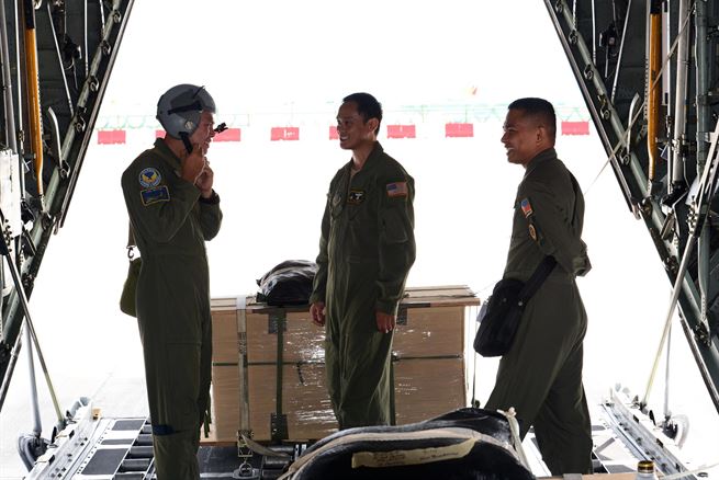 Philippine Air Force C-130 crew members prepare a U.S. Air Force C-130 Hercules aircraft for low-cost, low-altitude airdrop operations with U.S. Air Force Tech. Sgt. John Quiason (middle), 36th Airlift Squadron, 374th Airlift Wing, Yokota Air Base, Japan, during the current iteration of a rotational Air Contingent at Brigadier General Benito N Ebuen Air Base, Lapu-Lapu City, Philippines, Oct. 5, 2016. For the exchange, Yokota-based C-130s flew with members of the Philippine Air Force&#39;s 220th Airlift Wing, from Brig. Gen. Benito N. Ebuen Air Base, Lapu-Lapu City, Philippines, and discussed the intricacies of LCLA bundle drops. Two Yokota-based C-130s and crews, members of the 36th Contingency Response Group, Andersen Air Force Base, Guam, and other units from across U.S. Pacific Command conducted bilateral training missions and subject matter expert exchanges alongside their Philippine Air Force counterparts. The Air Contingent is helping build the capacity of the Philippine Air Force and increases joint training, promotes interoperability and provides greater and more transparent air and maritime situational awareness to ensure safety for military and civilian activities in international waters and airspace. Its missions include air and maritime domain awareness, personnel recovery, combating piracy, and assuring access to the air and maritime domains in accordance with international law.