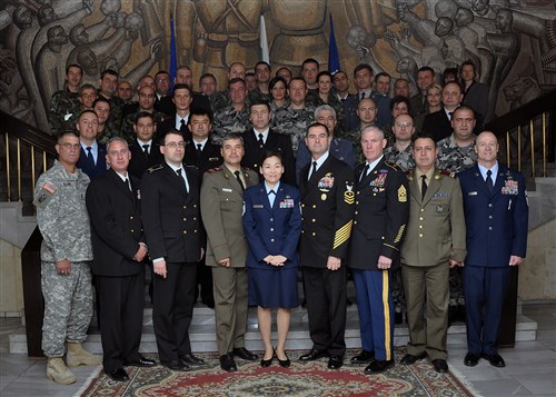 SOFIA, Bulgaria -- Senior enlisted leaders from Bulgarian and U.S. military forces pose for a group photograph before the final day of the first joint-nation NCO symposium at the Bulgarian Land Forces headquarters here April 11. More than 40 senior enlisted leaders met to discuss doctrine, strengths and leadership philosophies, which are designed to empower and inspire NCOs in both nations' corps.