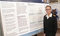 Lieutenant-Commander Vincent Beswick-Escanlar, a recent graduate of the preventive medicine residency at the Uniformed Services University of the Health Sciences (USU), presents a poster at its Research Days event.