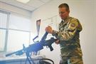 Army Reserve capt. Jason Smigelski, G3/Training Officer, 85th Support Command, conducts a visual/physical inspection of the M249 to determine if there are any noticeable defects. The weapon is one of several weapon systems used in the command&#39;s EST-2000 (engagement skills trainer). The 85th Support Command houses a 10-lane system for use in zeroing to qualifying in a dedicated building at the command&#39;s installation. The EST 2000 provides a variety of weapon ranging from the M9 to the M136/AT4. The facility is available for federal, local and state agencies to train on and it sees use by a wide variety of organizations throughout the year. The EST 2000 creates a realistic marksmanship and combat scenario training for 12 of the most common small arms and crew-served weapons and individual anti-tank weapons in the US Army inventory.
 (Photo by Mr. Anthony L. Taylor)