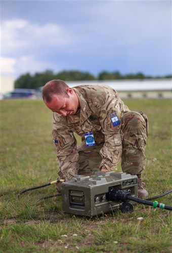 A British soldier from the British Signals Regiment sets up power distribution for in preparation for Exercise Combined Endeavor 2014 at Grafenwoehr, Germany. Combined Endeavor is the preeminent command, control, communications and computer, or C4, systems exercise used for preparing international forces for multinational operations. The goal of Combined Endeavor is to foster stronger alliance and regional relations and security arrangements through C4 systems interoperability testing between NATO and Partnership for Peace nations’ strategic and tactical communication systems. 