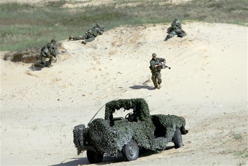 RAMSTEIN, Germany ~~ Troops taking their defence positions July 22. (Department of Defense photo by Normunds Mezins)