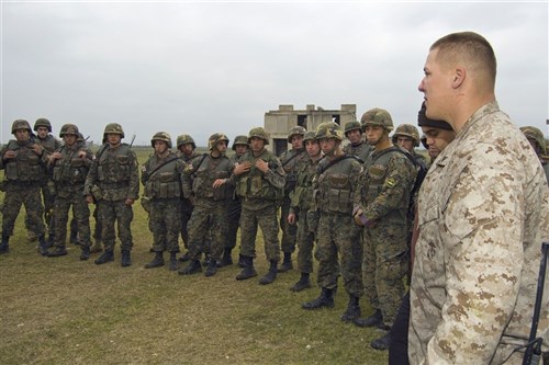 KRTSANISI, Georgia &mdash; Lance Cpl. Robert C. Wallisch, an instructor with the Georgia Training Team, gives a briefing to a company of Georgian soldiers prior to a company field exercise here, Nov. 13. The Georgia Deployment Program is a two-year training program with a goal to increase interoperability between the Georgian Army and International Security Assistance Forces (ISAF). The training consists of four 6-month rotations designed to train four Georgian infantry battalions in counterinsurgency tactics, techniques and procedures in preparation for their deployment to Afghanistan in support of ISAF. (U.S. Marine Corps photo by Master Sgt. Grady T. Fontana)