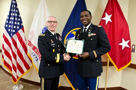 Maj. Gen. Peter S. Lennon, Deputy Commanding General (Support), U.S. Army Reserve, presents Capt. Edgar Borgella, course director assigned to the 83rd U.S. Army Reserve Readiness Training Center, with an Army Commendation Award for his selection as the U.S. Army Reserve Instructor of the Year (Officer), at USARC headquarters, Feb. 11, 2016. Borgella was honored alongside winners from the noncommissioned officer and warrant officer category, in the first USARC hosted Instructor of the Year Ceremony held here. (U.S. Army Reserve photo by Brian Godette, USARC Public Affairs)