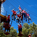 Youth navigating a high ropes course