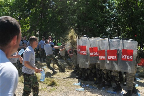 CAMP MONTEITH, Kosovo &mdash; Turkish soldiers repel assaults from simulated rioters from the Portuguese army during an exercise at Camp Monteith, Kosovo, May 27. (U.S. Army photo by Sgt. Joshua Dodds)
