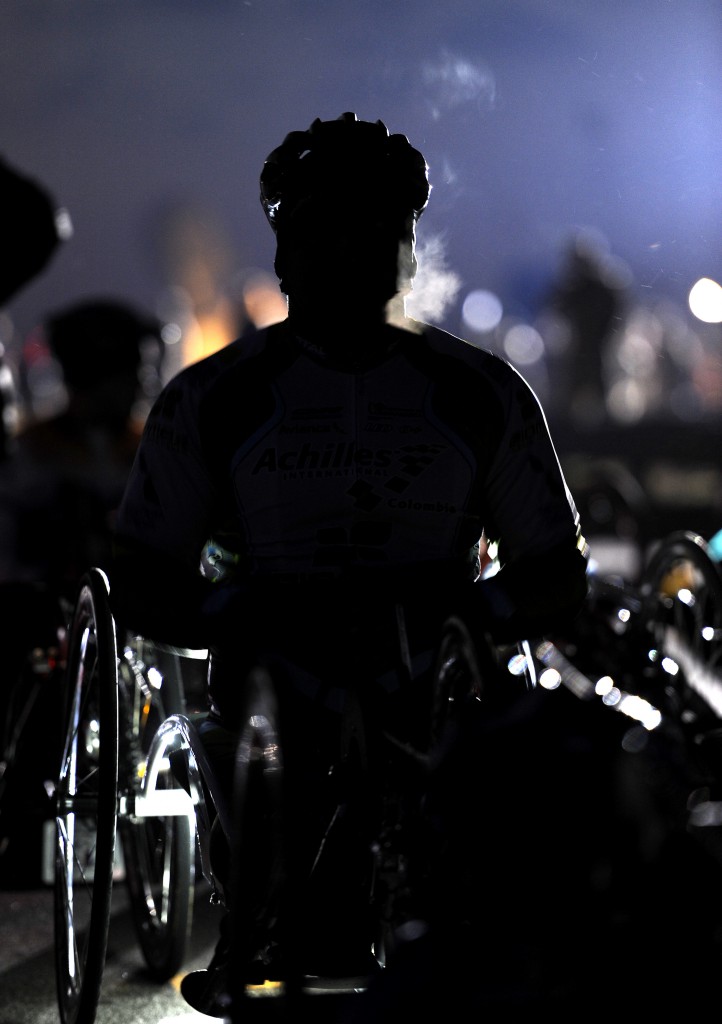 A hand cyclist waits in the dark for the start of the 38th Marine Corps Marathon through Washington, DC, and Arlington, Virginia on 27 October 2013. FootStomp Photo/Roger L. Wollenberg