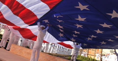 NSA Souda Bay - Sailors position a flag for a Memorial Day Ceremony