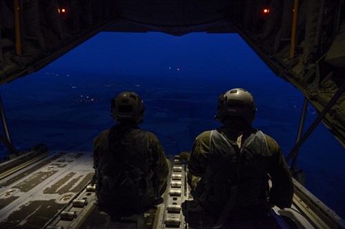 Senior Airman Emily Mitchell and Staff Sgt. Joshua Nelson, both 37th Airlift Squadron loadmasters sit on the ramp of a C-130J Super Hercules during a formation flight during Exercise Thracian Summer 2016 July 17, Plovdiv, Bulgaria. Through Exercise Thracian Summer, the U.S. and Bulgaria will enhance their mutual ability to work together, with other NATO nations, and with key partners on regional security (U.S. Air Force photo/Senior Airman Nicole Keim)