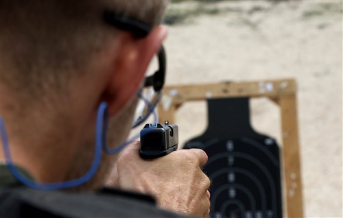A member of the Kosovo Force (KFOR) International Military Police, in Kosovo, aims his pistol at a target during a marksmanship training held on Camp Bondsteel, Kosovo, July 26, 2016. U.S. and NATO forces have contributed to the United Nations-mandated peacekeeping mission in Kosovo since June 1999.
(U.S. Army photo by: Staff Sgt. Thomas Duval, Multinational Battle Group-East Public Affairs)