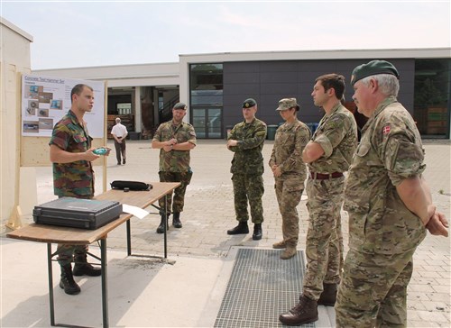 U.S. Army 2nd Lt. Katelynn Clark (center), an assistant operations officer for the 10th Engineer Battalion, 1st Armored Brigade Combat Team, 3rd Infantry Division, listens as a Belgian officer talks about different equipment they use to assess bridges during a an International Bridge Assessment Course at Ingolstadt, Germany July 12. The course, a bilateral project from the Belgian and German engineer schools, supported by the Military Engineering Centre of Excellence, aims to inform Soldiers on the different existing bridge assessment methods.