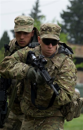 U.S. and Georgian Soldiers participate in close quarters battle drills, May 13, during Exercise Noble Partner 15. The two partner nations worked in teams to clear rooms and practice tactics, learning how to communicate while working together. One of the training tools used included white tape to simulate mock room. A two-man team of a U.S. and Georgian soldiers practiced clearing the objective. The U.S. Soldiers participating in the exercise are assigned to Company A, 2nd Battalion, 7th Infantry Regiment, 1st Brigade, 3rd Infantry Division, and Troop C, 1st Squadron, 91st Cavalry Regiment, 173rd Abn. Bde. The Georgian soldiers are assigned to Company A, 12th Battalion, 1st Infantry Brigade. Noble Partner is a field training and live-fire exercise between the U.S. Army and the Georgian military to support Georgia's participation in the NATO Response Force and build military ties between the two nations. (U.S. Army Photo by Sgt. Daniel Cole, Army Europe Public Affairs/Released)