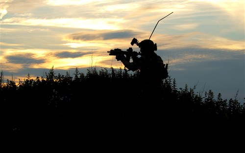 A Combat Rescue Officer from the 321st Special Tactics Squadron scans the perimeter while participating in an exercise June 25, 2015, at RAF Sculthorpe in Norfolk, England. Combat Rescue Officers, CRO’s, organize and strategize recovery missions, train and equip rescue personnel and manage and develop survival skills programs. (U.S. Air Force photo by Senior Airman Victoria H. Taylor)