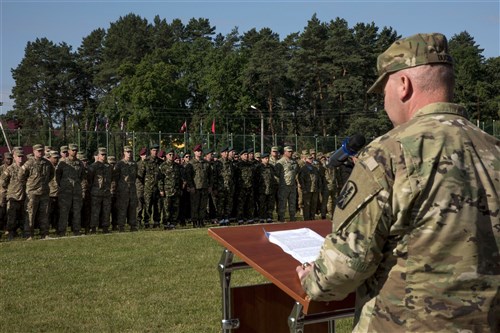 Col. Nick Ducich, the commander of the Joint Multinational Training Group – Ukraine addresses multinational Soldiers during the closing ceremony for Exercise Rapid Trident 16 in Yavoriv, Ukraine July 8, 2016. The exercise is a regional command post and field training exercise that involves about 2,000 Soldiers from 13 different nations, being held at the International Peacekeeping and Security Center in Yavoriv, Ukraine June 27 - July 8, 2016. (U.S. Army photo by Sgt. 1st Class Whitney Hughes/Released)