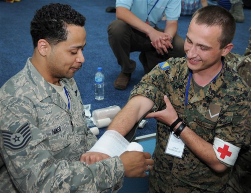 U.S. Air Force Tech. Sgt. Phillip Hines, U.S. Air Force School of Aerospace Medicine, demonstrates how to splint an arm with a structural aluminum malleable splint during the Critical Lifesaving Skills for First Responders course here May 29, 2012. During the course, instructors from the Defense Institute for Medical Operations worked with other countries' medical practitioners attending Shared Resilience 2012 to exchange medical ideas and techniques. More than 500 military members from nine nations are participating in the annual U.S. Joint Chiefs of Staff-sponsored exercise May 28 - June 8. The goals of the exercise are to strengthen interoperability, facilitate training in crisis response and disaster management, and validate the readiness of deployable military medical and humanitarian assistance teams. The exercise, in the spirit of partnership for peace, directly supports U.S. European Command's theater cooperation efforts and strategy for active security with European countries.