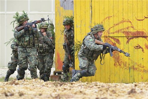 Albanian soldiers race to a new position during exercise Combined Resolve III at the Hohenfels Training Area (Germany), Oct. 27, 2014. Albanian is one of over a dozen NATO and European partner nations participating in the bi-annual exercise at the U.S. Army's major training areas in southeastern Germany to enhance connections -- personal, professional, technical and tactical -- in a multinational brigade training environment. (U.S. Army photo by Gertrud Zach)