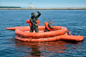 Air Force pilots working in a life boat.