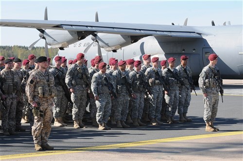 RIGA, Latvia – Paratroopers from U.S. Army Europe’s 173rd Infantry Brigade Combat Team (Airborne) and Latvian Soldiers stand in formation during a ceremony commemorating new exercises here, April 24, 2014. The paratroopers, part of a company-sized contingent, arrived here to begin exercises with Latvian troops in a series of expanded U.S. land forces training activities in Poland and the Baltic region scheduled to take place for the next few months and beyond. The multinational training fulfills the USAREUR strategic objective of preserving and enhancing NATO interoperability and demonstrates the United States' commitment to NATO Allies. 