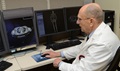 Dr. Howard Harcke, Office of the Armed Forces Medical Examiner forensic radiologist, looks at a CT scan for diagnostic clues at the Armed Forces Medical Examiner System on Dover Air Force Base, Delaware. 