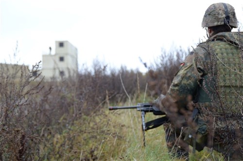 1st Light Infantry Regiment, 2nd Company, approaches the city of "Tiji" at Camp Robertson in Schweinfurt, Germany, during training exercises in late October. The German regiment used U.S. Army Garrison Schweinfurt's training grounds prior to its deployment to Afghanistan.