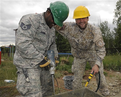 Corporal Anders Bukovskis, Latvian National Armed Forces and Staff Sgt. Jarriel Brown, 127th Civil Engineering Squadron electrical journeymen, work on renovations for a kindergarten in Silmala, Latvia on June 18, 2016. The school’s renovations are part of a Humanitarian-Civic Assistance project. The project provides training opportunities for the United States and Latvian soldiers as well as a benefit for the local community. (U.S. Air National Guard photo by Senior Airman Ryan Zeski)