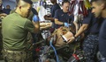 Navy corpsmen treat a notional casualty during a training evolution on Camp Lejeune, North Carolina. The Navy Medical Augmentation Program Sustainment Training brings corpsmen from up and down the east coast to Camp Lejeune to get hands-on training. The corpsmen are all attached to the 2nd Medical Battalion but are assigned at different stations throughout the east coast. (U.S. Marine Corps photo by Lance Cpl. Jon Sosner)