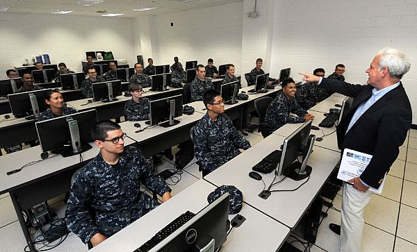 U.S. Rep. Bradley Byrne from Alabama talks to Information Systems Technician "A" school students at the Center for Information Dominance Unit Corry Station during a tour of Corry Station.  U.S. Navy photo by Gary Nichols (Released)  141002-N-GS507-306