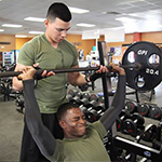 Service members at the gym