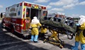 Members of the Omaha Fire and Rescue Department load a simulated patient into an ambulance during exercise Patriot 15, at Offutt Air Force Base, Nebraska.