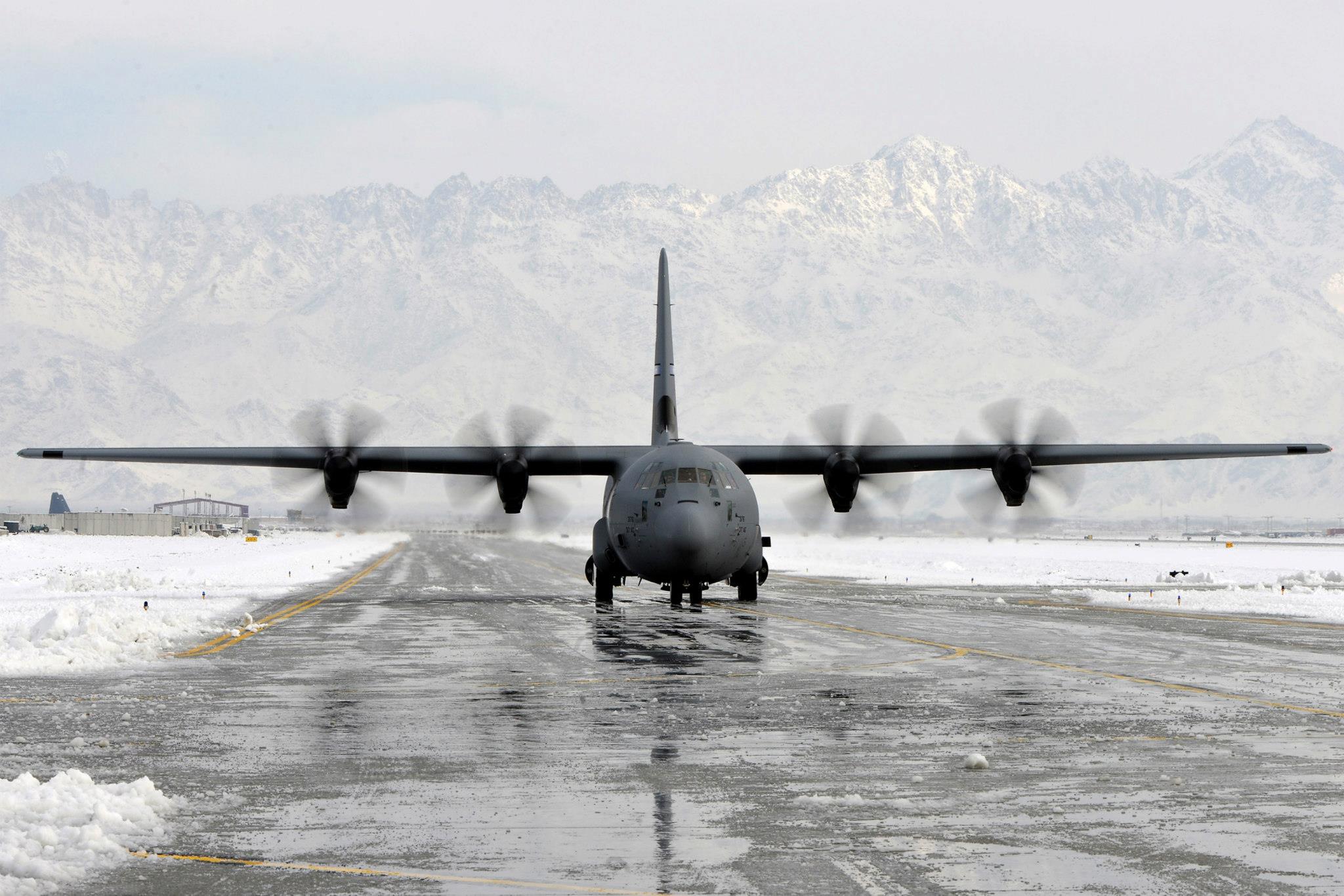 A C-130 Hercules taxis to its parking spot in Southwest Asia, on Dec. 28, 2012. Snow removal teams used specialized equipment to clear the runways and taxiways after an overnight snowfall covered the flightline with more than three inches of snow. (U.S. Air Force photo/Senior Airman Chris Willis)