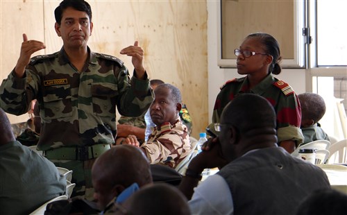 Indian Army Lt. Col. Ajay Dogra, military training officer with the United Nations Department of Peacekeeping Operations, teaches Central Accord 2016 participants about U.N. functions and procedures June 14, at the Cooperative Security Location in Libreville, Gabon. U.S. Army Africa's exercise Central Accord 2016 is an annual, combined, joint military exercise that brings together partner nations to practice and demonstrate proficiency in conducting peacekeeping operations. (U.S. Army Africa photo by Staff Sgt. Candace Mundt)