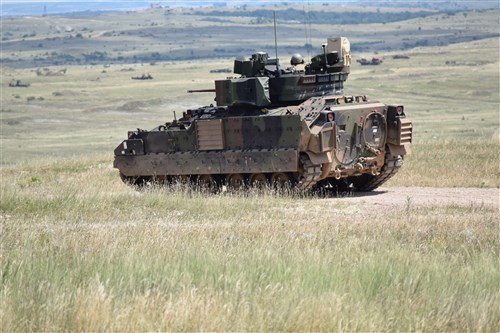 A M2A3 Bradley Fighting Vehicle from 5th Squadron, 7th Calvary Regiment scans for targets during a section gunnery qualification at Camp Ujmajor, Hungary July 21. The squadron continues to progress through their gunnery qualification tables as they build up to a Combined Arms Live Fire Exercise in August.
