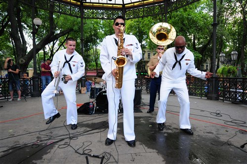 ODESSA, Ukraine - Musician 3rd Class Patrick Pedlar, left on trumpet, Musician 3rd Class Andrew Francisco on tenor saxophone, Musician 2nd Class Willie Brandon, right, Marine Staff Sgt. Robert Hungerford, tuba, from U.S. Naval Forces Europe Band, Topside, perform for a crowd in Odessa as part of Exercise Sea Breeze 2012 (SB12). SB12, co-hosted by the Ukrainian and U.S. navies, aims to improve maritime safety, security and stability engagements in the Black Sea by enhancing the capabilities of  Partnership for Peace and Black Sea regional maritime security forces. 