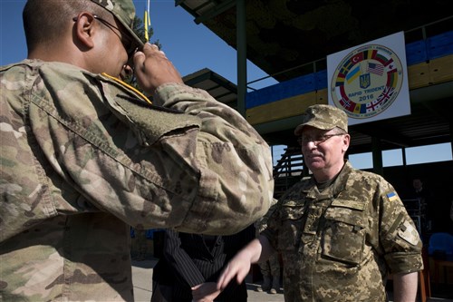 Ukrainian Lt. Gen. Pavlo Tkachuk, the Chief of the Ukrianian National Military Academy prepares to return the salute of a U.S. Soldier during the closing ceremony for Exercise Rapid Trident 16 in Yavoriv, Ukraine July 8, 2016. The exercise is a regional command post and field training exercise that involves about 2,000 Soldiers from 13 different nations, being held at the International Peacekeeping and Security Center in Yavoriv, Ukraine June 27 - July 8, 2016. (U.S. Army photo by Sgt. 1st Class Whitney Hughes/Released)