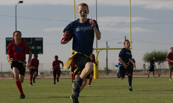 Youth participate in a flag football game on Marine Corps Air Station in Yuma, Arizona. (U.S. Marine Corps photo by Sgt. Travis Gershaneck)