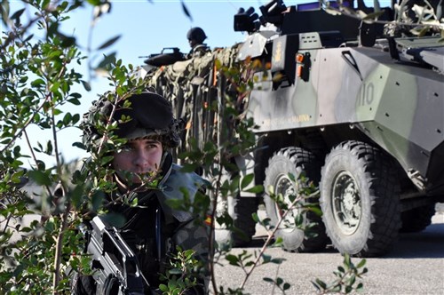 ROTA, Spain &mdash; A Spanish marine performs security while conducting convoy training during Exercise LISA AZUL at Naval Station Rota, Spain, Jan. 29.  LISA AZUL is a bi-lateral training exercise that promotes partnership and maritime security while improving cultural understanding between the U.S. and Spain. (U.S. Navy photo by Mass Communication Specialist 1st Class Paul Cage)