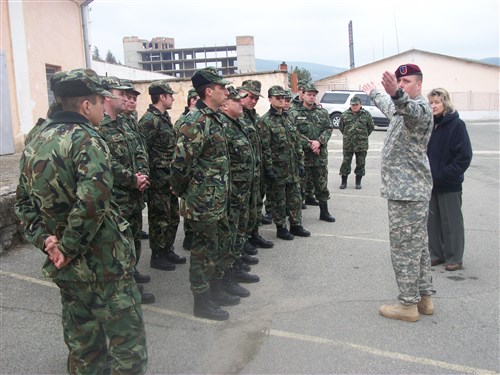 Chief Warrant Officer 2 Charles Drafall gestures to Bulgarian soldiers during Military Decision Making Process training in Stara Zagora, Bulgaria, Feb. 13.