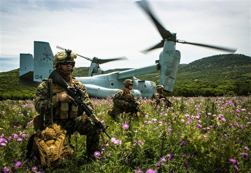 U.S. Marine Lance Cpl. Victor CastilloGarcia, left, a field radio operator from Special-Purpose Marine Air-Ground Task Force Crisis Response-Africa, provides security for an MV-22B Osprey at a landing zone in Sierra Del Retin, Spain, May 4, 2015. The Marines landed at the site to conduct range operations with the Spanish Marines, who used the Osprey as part of their battalion’s training exercise. (U.S. Marine Corps photo by Sgt. Paul Peterson/Released)