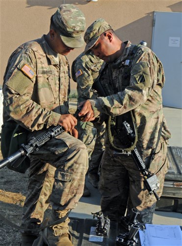 NOVO SELO TRAINING AREA, Bulgaria – Sgt. Ruben Casiano, (right) checks to make sure that Spc. Felix Munoz’s MILES gear is working properly July 21, 2016 before the soldiers head out to the field for an 11-day training exercise. MILES gear is a Multiple Integrated Laser Engagement System that uses lasers and blank cartridges to simulate battle. 1st Combined Arms Battalion, 64th Armor Regiment is in Bulgaria in support of Operation Atlantic Resolve, a U.S. led effort in Eastern Europe that demonstrates U.S. commitment to the collective security of NATO and enduring peace and stability in the region.