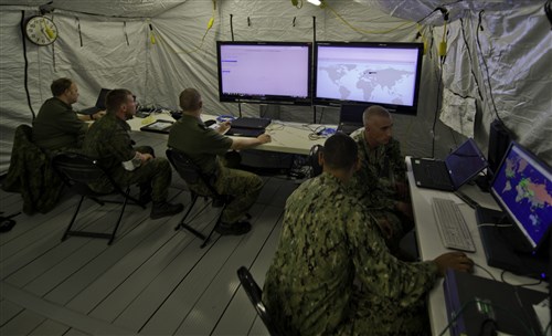 GRAFENWOEH, Germany - U.S. and Finland sailors conduct tests during Combined Endeavor (CE) 2012, at the Joint Multinational Training Command, Grafenwoehr, Germany, Sept. 6, 2012. U.S. and Finland sailors conducted Command Operational Picture testing to ensure systems work together. CE is a multinational command, control, communications and computer systems exercise designed to build and enhance communications and network interoperability between 41 nations and international organizations.