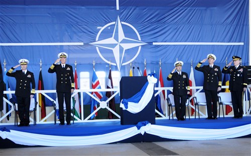 NAPLES, Italy (Feb. 24, 2012) - (From left to right) Adm. Bruce W. Clingan, and Adm. Samuel J. Locklear III, Commander, U.S. Naval Forces Europe-Africa, and Commander, Allied Joint Forces Command Naples; Adm. James Stavridis, Supreme Allied Commander, Europe, and Commander, U.S. European Command; Adm. Jonathan Greenert, Chief of Naval Operations; and U.S. Army Gen. Carter F. Ham, Commander, U.S. Africa Command, salute during the parading of the colors at today's change of command ceremony on Naval Support Activity Naples. During the ceremony, Clingan relieved Locklear as Commander, U.S. Naval Forces Europe-Africa and Commander, Allied Joint Forces Command. 